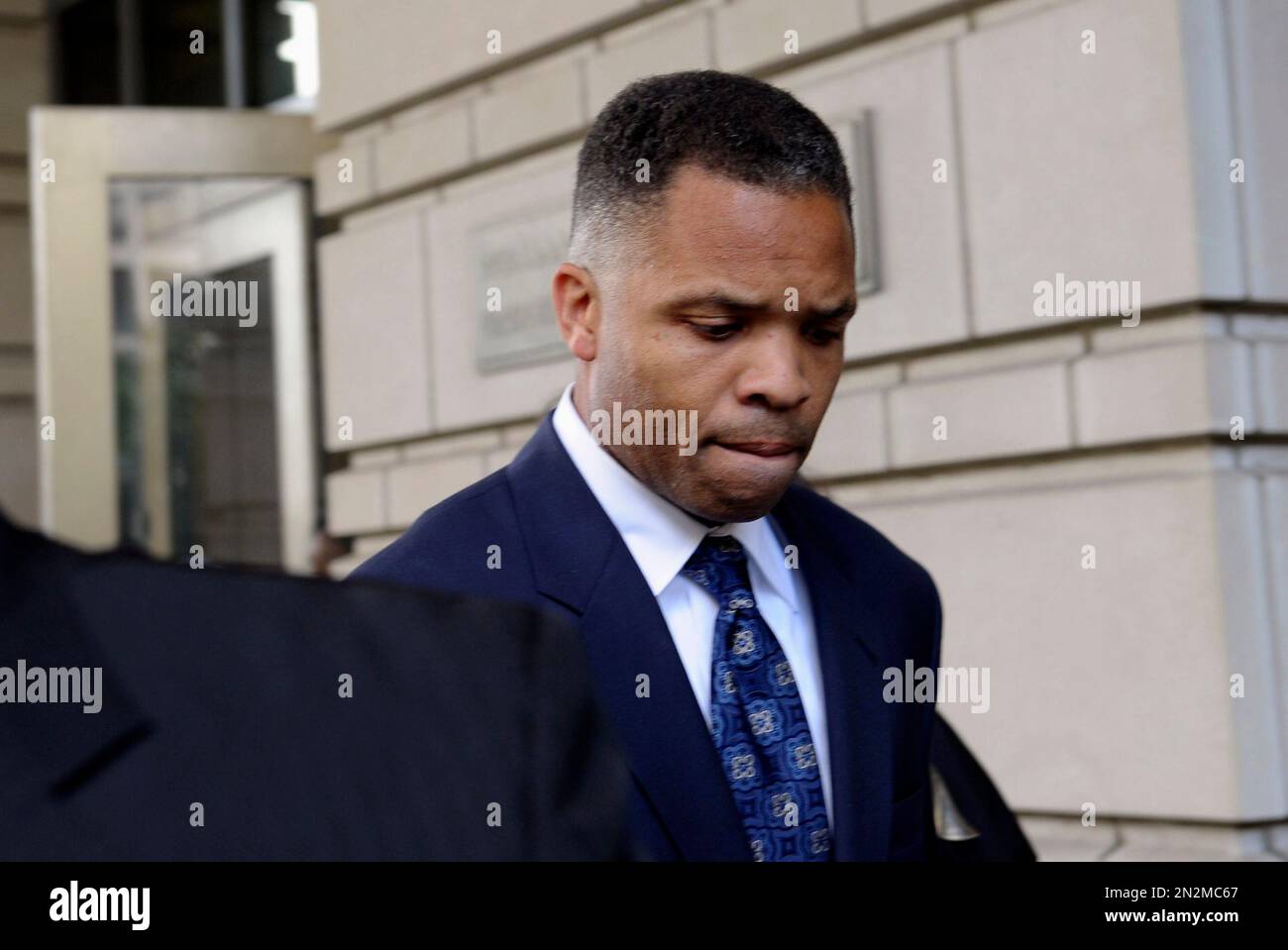 FILE - In this Aug. 14, 2013, file photo, former Illinois Rep. Jesse Jackson Jr., leaves federal court in Washington after being sentenced to 2 1/2 years in prison for misusing $750,000 in campaign funds. Jackson Jr. will be released from a federal prison on Thursday, March 26, 2015, and will serve out the remainder of his term in a Washington, D.C., halfway house, former U.S. Rep. Patrick Kennedy told The Associated Press after visiting Jackson behind bars. (AP Photo/Susan Walsh, File) Stock Photo