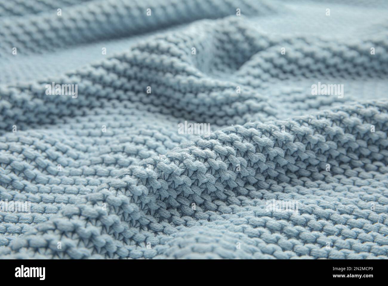 Modern blue knitted woolen fabric hi-res stock photography and images ...