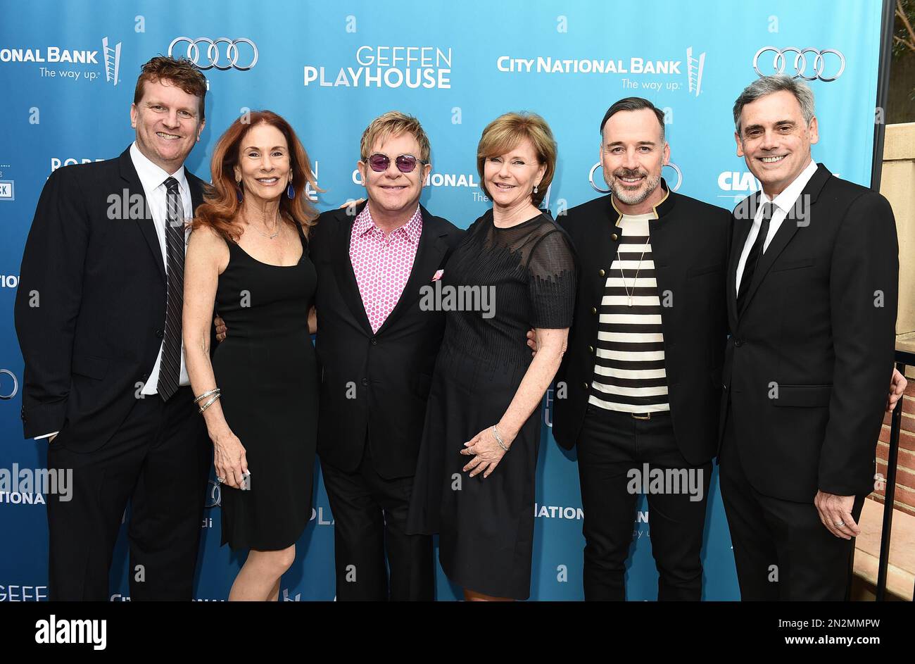 Gil Cates Jr., from left, Pamela Robinson, Elton John, Martha Henderson, David Furnish and Randall Arney attend Backstage at the Geffen on Sunday, March 22, 2015, in Los Angeles. (Photo by Jordan Strauss/Invision for Geffen Playhouse/AP Images) Stock Photo
