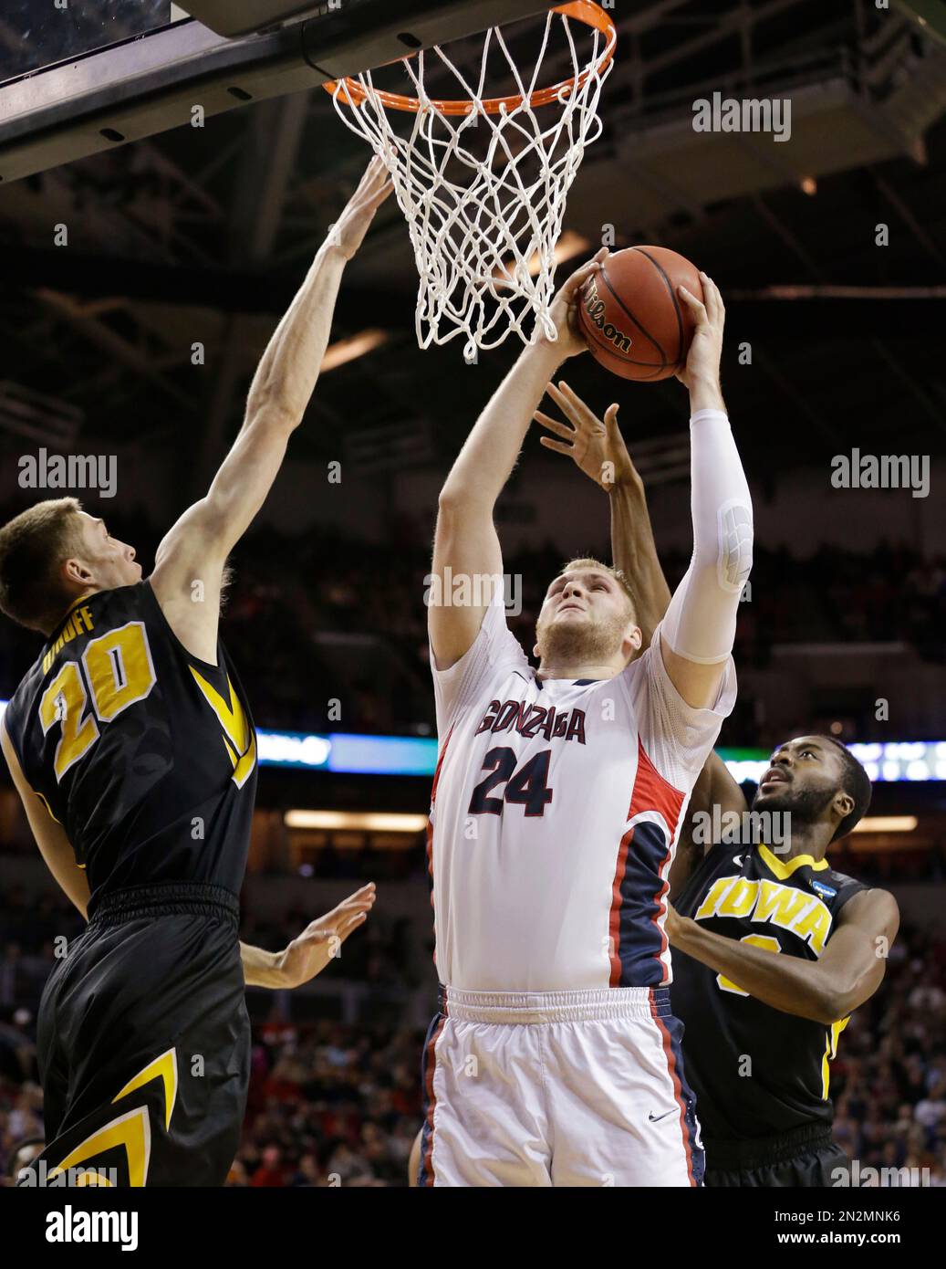 Gonzaga's Przemek Karnowski (24) shoots between Iowa's Jarrod Uthoff