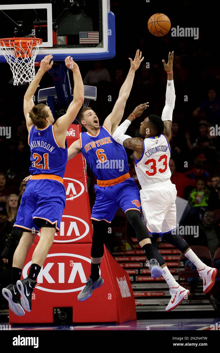 Philadelphia 76ers' Robert Covington (33) goes up to shoot against New