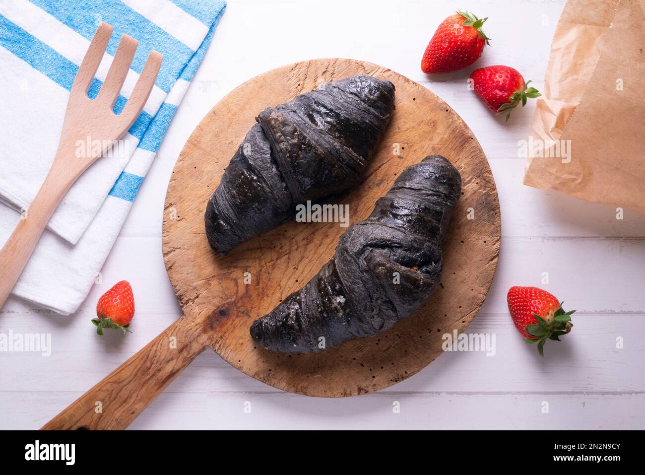 Croissant made with activated charcoal. Vegan breakfast Stock Photo Alamy