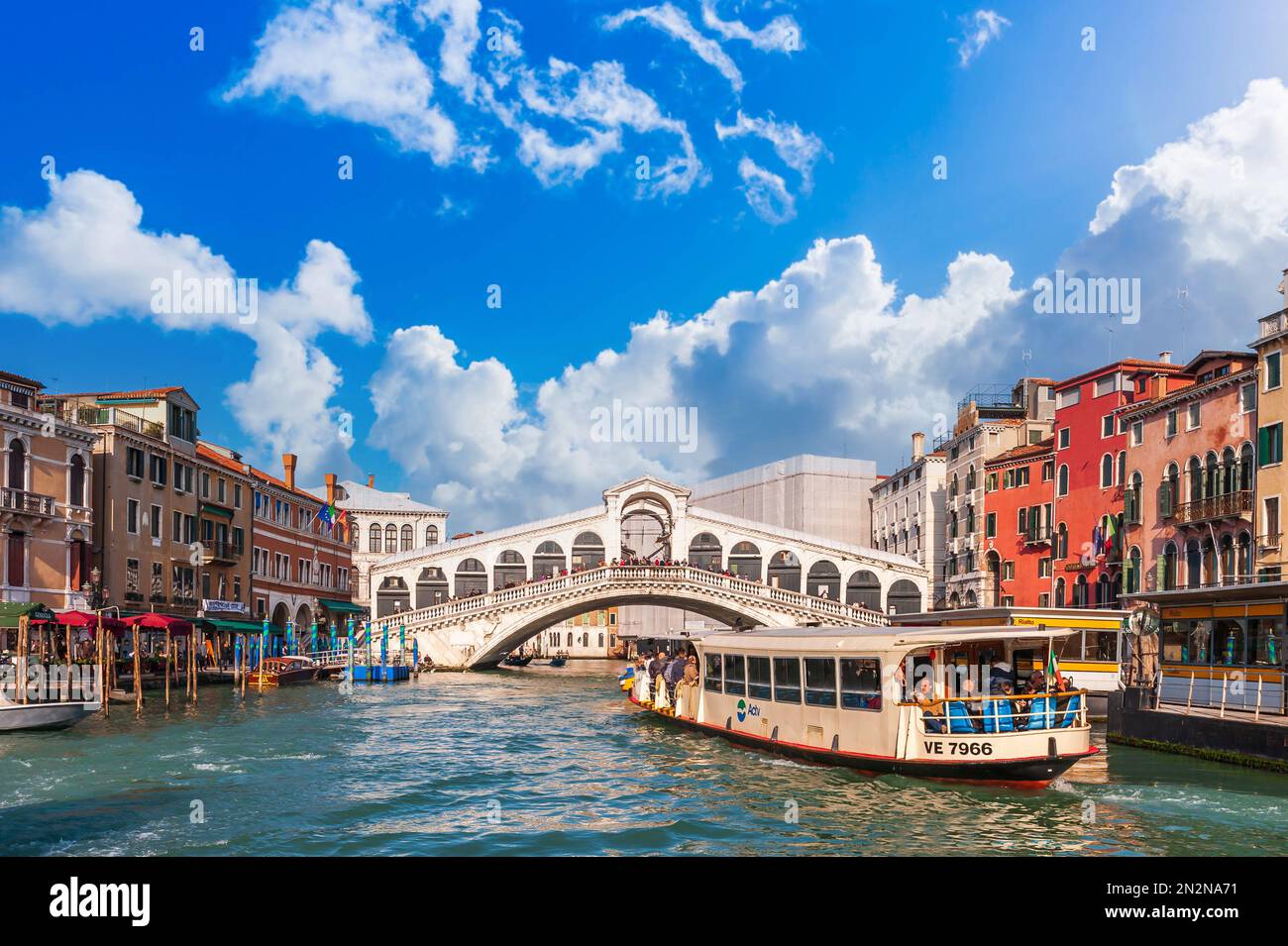 A vaporetto on the Grand Canal in front of the Rialto Bridge in Venice, Veneto, Italy Stock Photo