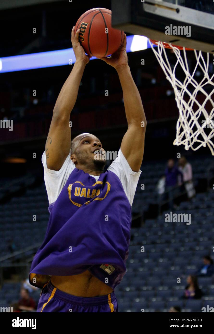 Albany guard/forward Ray Sanders goes up for a dunk during practice for