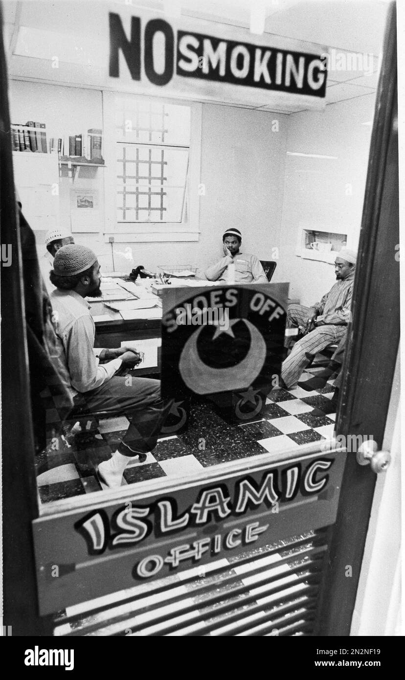 Muslim minister Abdul Shaheed holds his head in his hand as he talks to ...