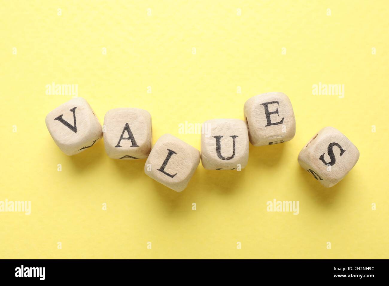 Beads with word VALUES on yellow background, flat lay Stock Photo - Alamy