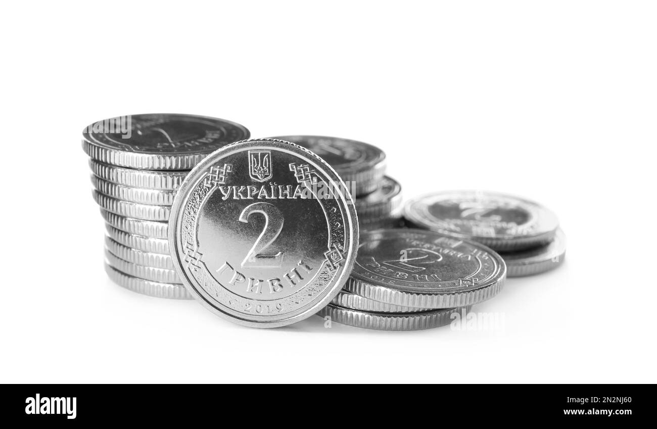 Stacks of Ukrainian coins on white background. National currency Stock Photo