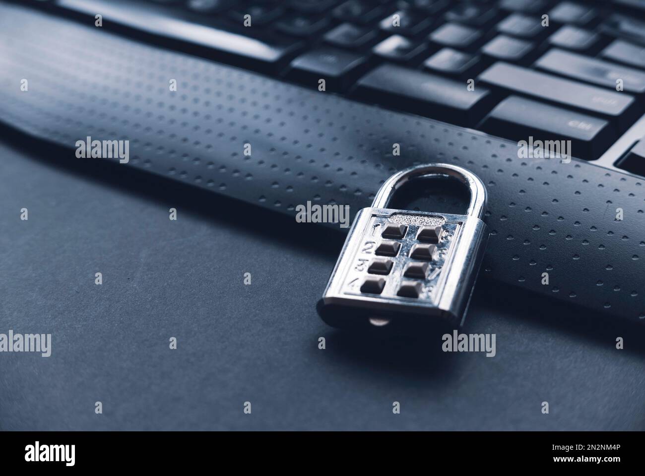 Computer security concept. A padlock on a computer keyboard. Stock Photo