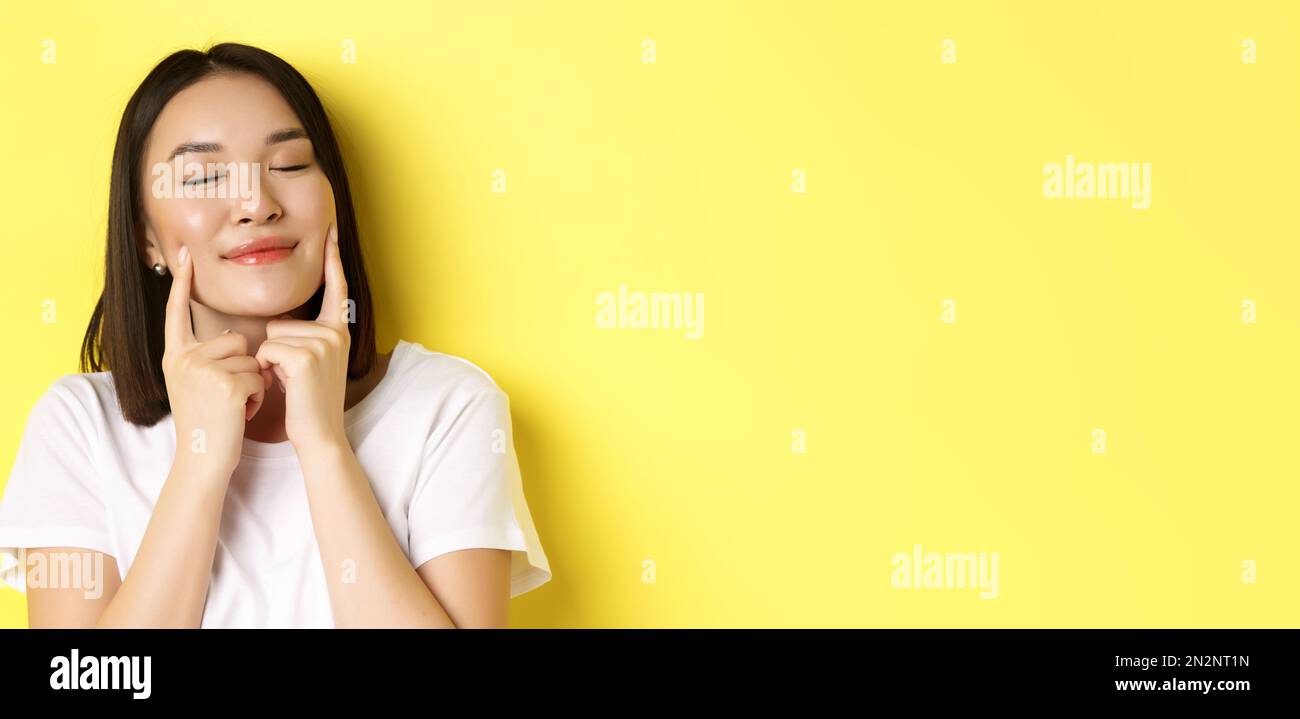 Beauty and skincare. Close up of young asian woman with short dark hair ...