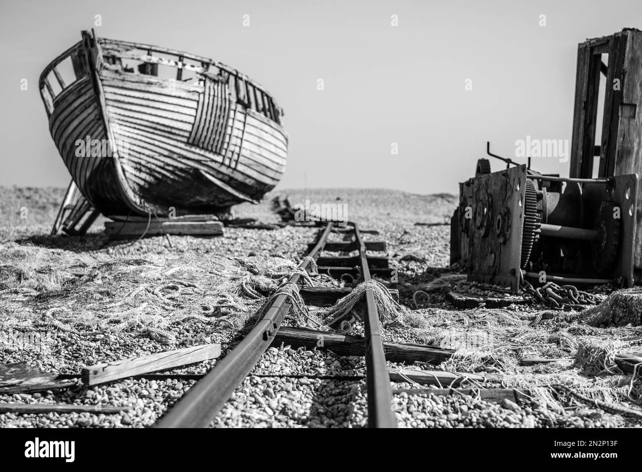 Beautiful old wooden fishing boats, abandoned on the shale beach at ...