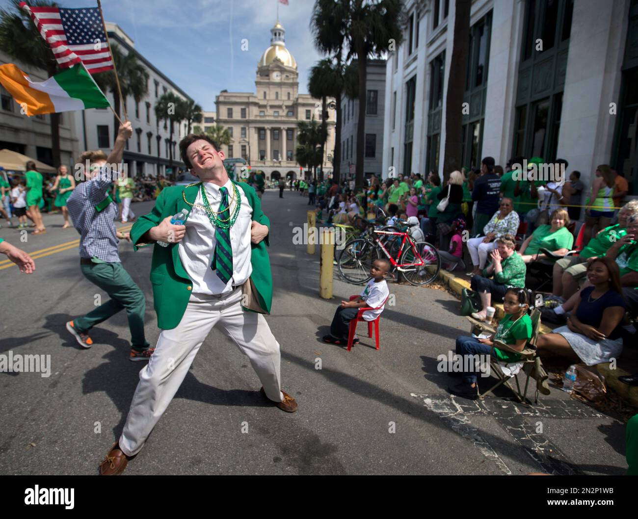 Lamar Lester III dances while marching with the Doherty Clan during the  191st St. Patrick's Day parade, Tuesday, March 17, 2015, in Savannah, Ga.  Organizers have long billed the Savannah St. Patrick's