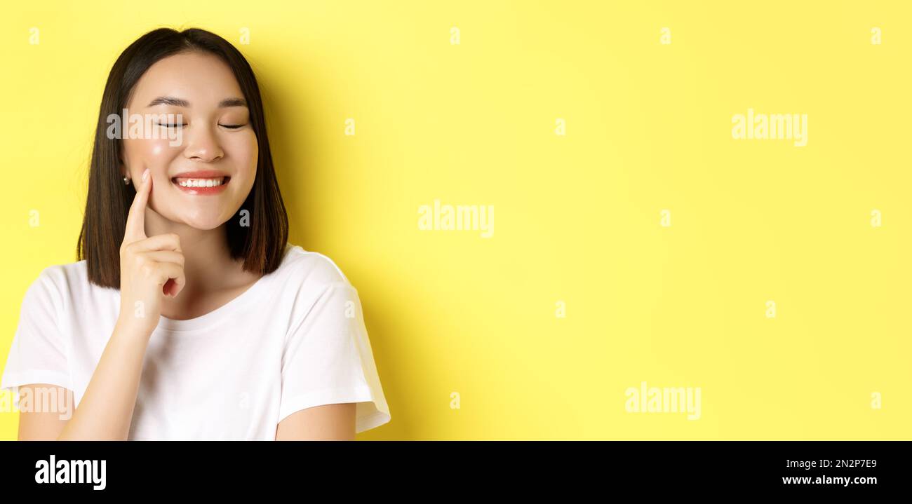 Beauty and skincare. Close up of young asian woman with short dark hair ...