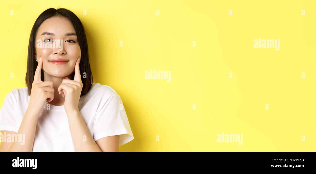 Beauty and skincare. Close up of young asian woman with short dark hair ...