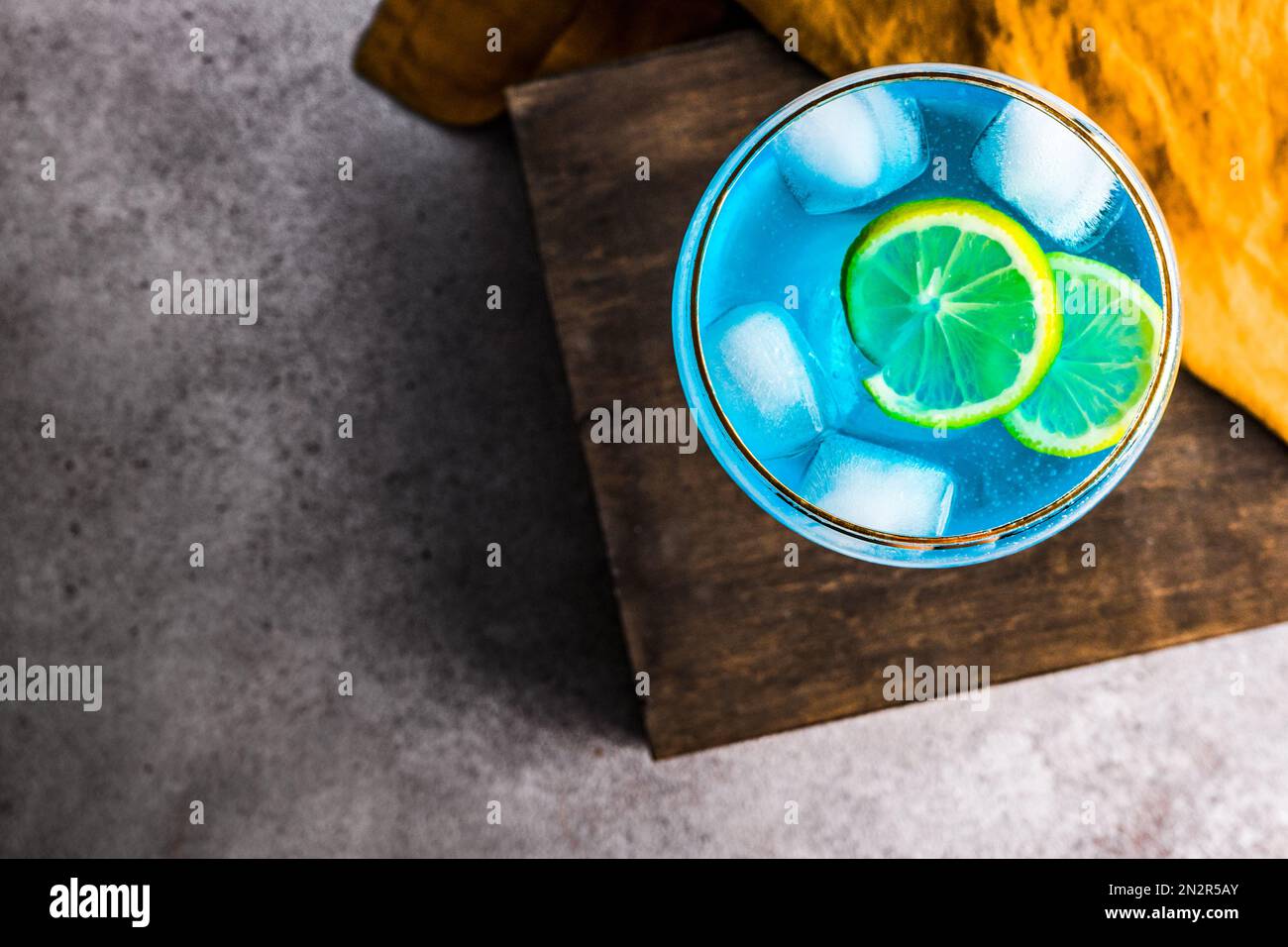 Overhead view of a blue kamikaze cocktail on a table Stock Photo - Alamy