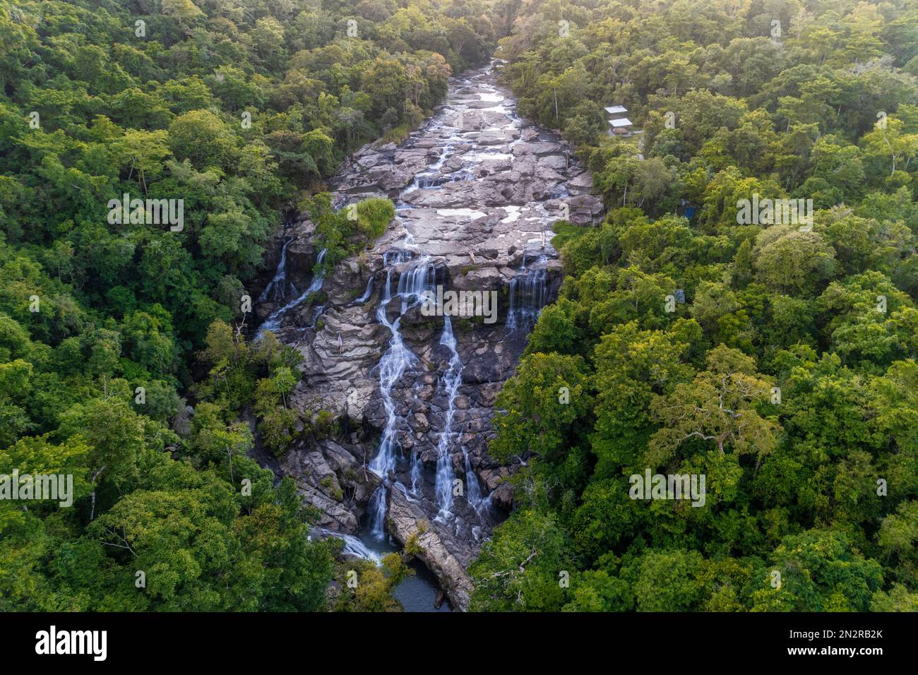Aerial view of River and waterfall in the jungle, Moyo Hulu, Sumbawa Island, Indonesia Stock Photo