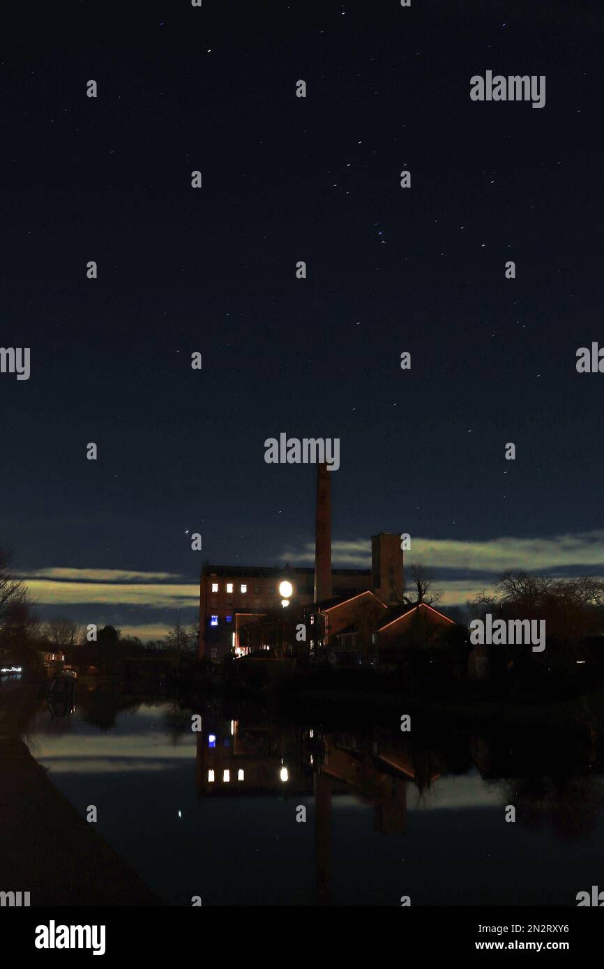 Burscough Mill under the stars, on a clear winters evening the stars are out over the former Ainscough’s flour mill in Burscough West Lancashire. Stock Photo