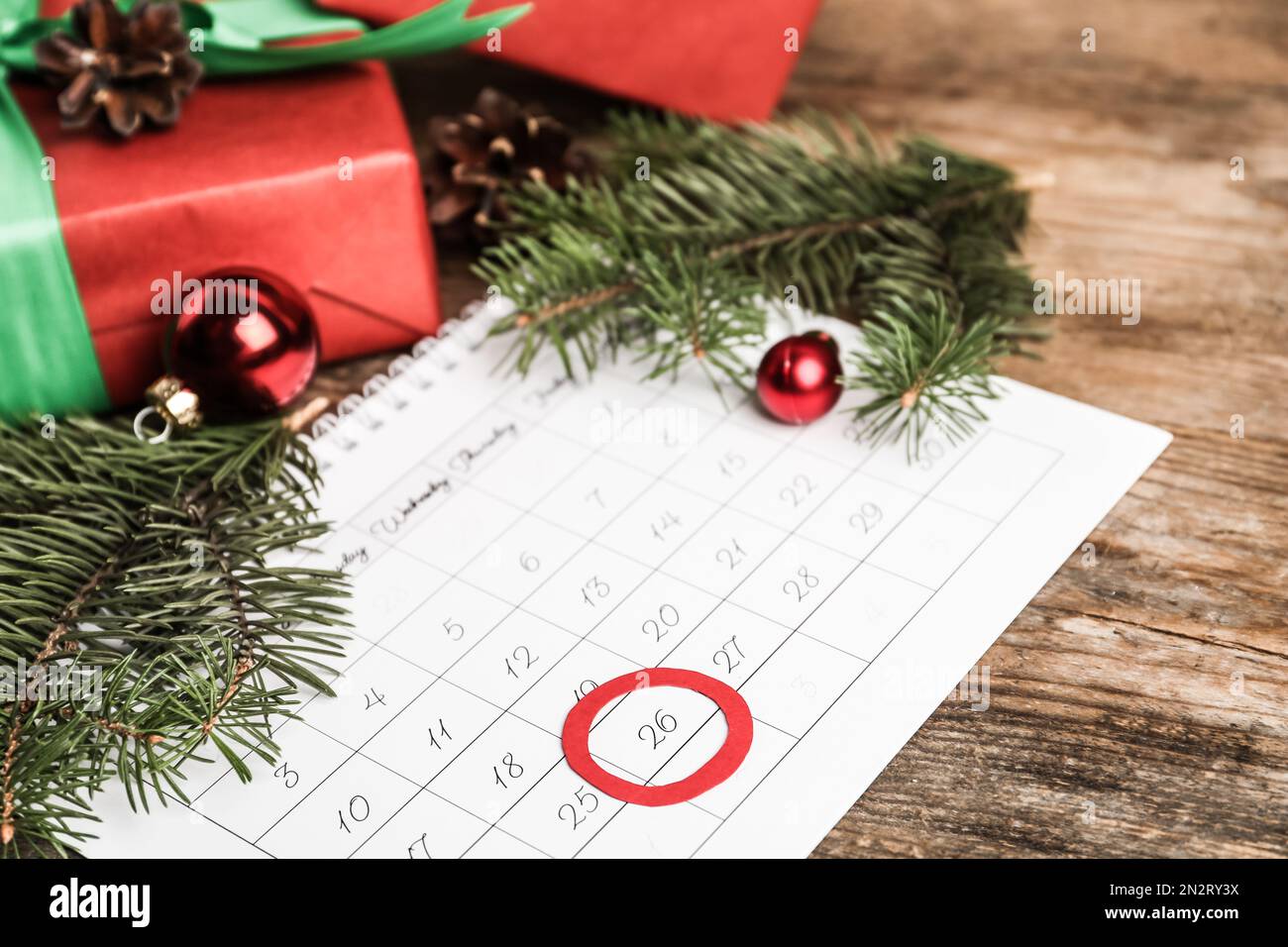 Calendar with marked Boxing Day date near gifts Stock Photo Alamy