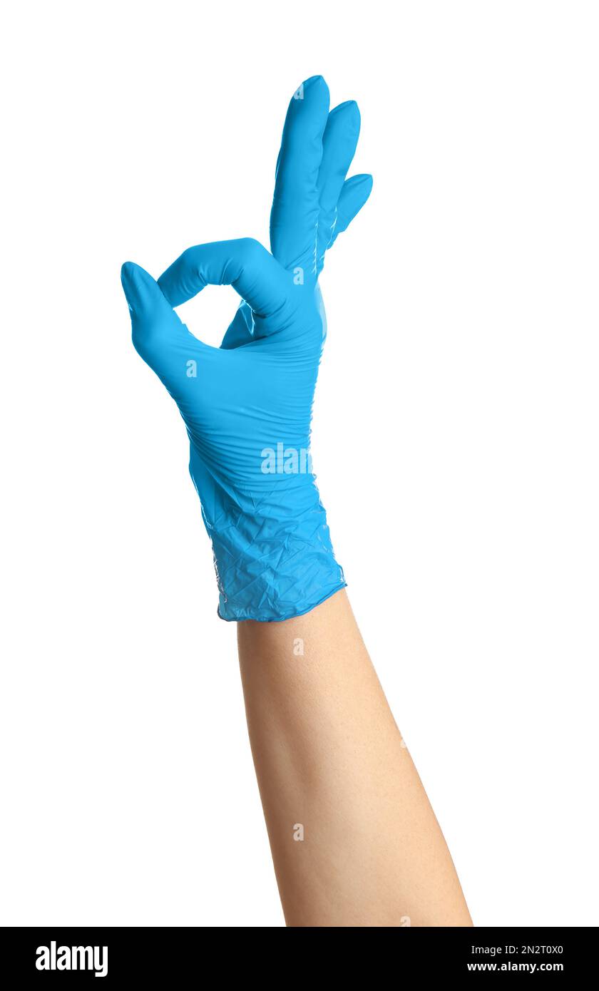 Woman in blue latex gloves showing OK gesture on white background