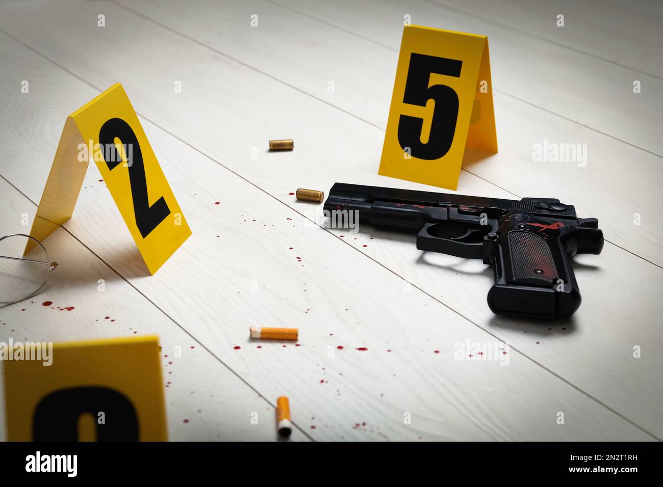Evidences and crime scene marker on white wooden table Stock Photo - Alamy