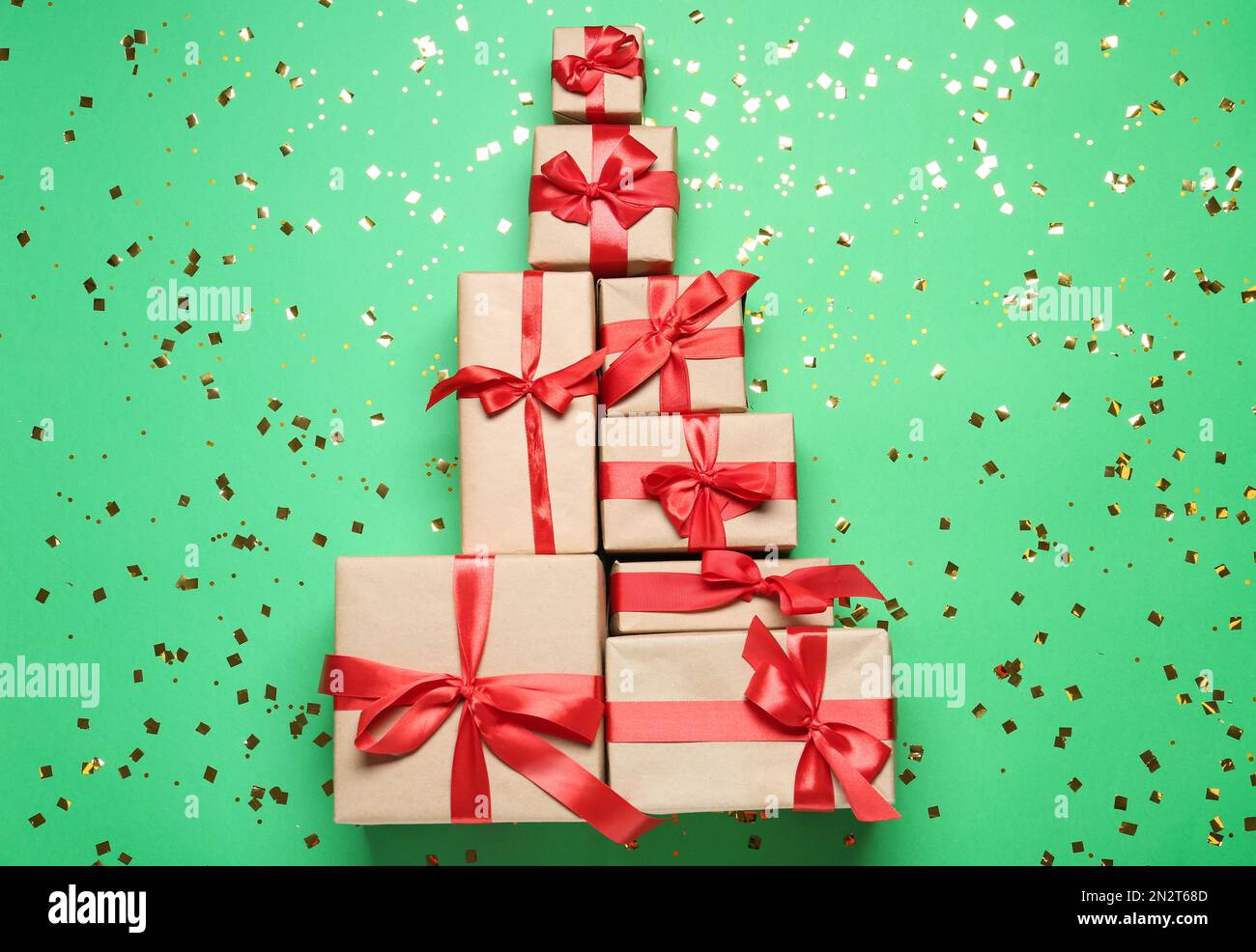 Christmas tree made with different gift boxes on green background, flat ...
