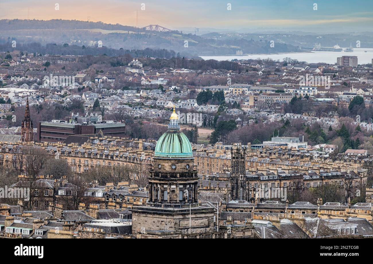 View across city of tenements & West Register House copper dome, church spires & bungalows, Edinburgh, Scotland, UK Stock Photo