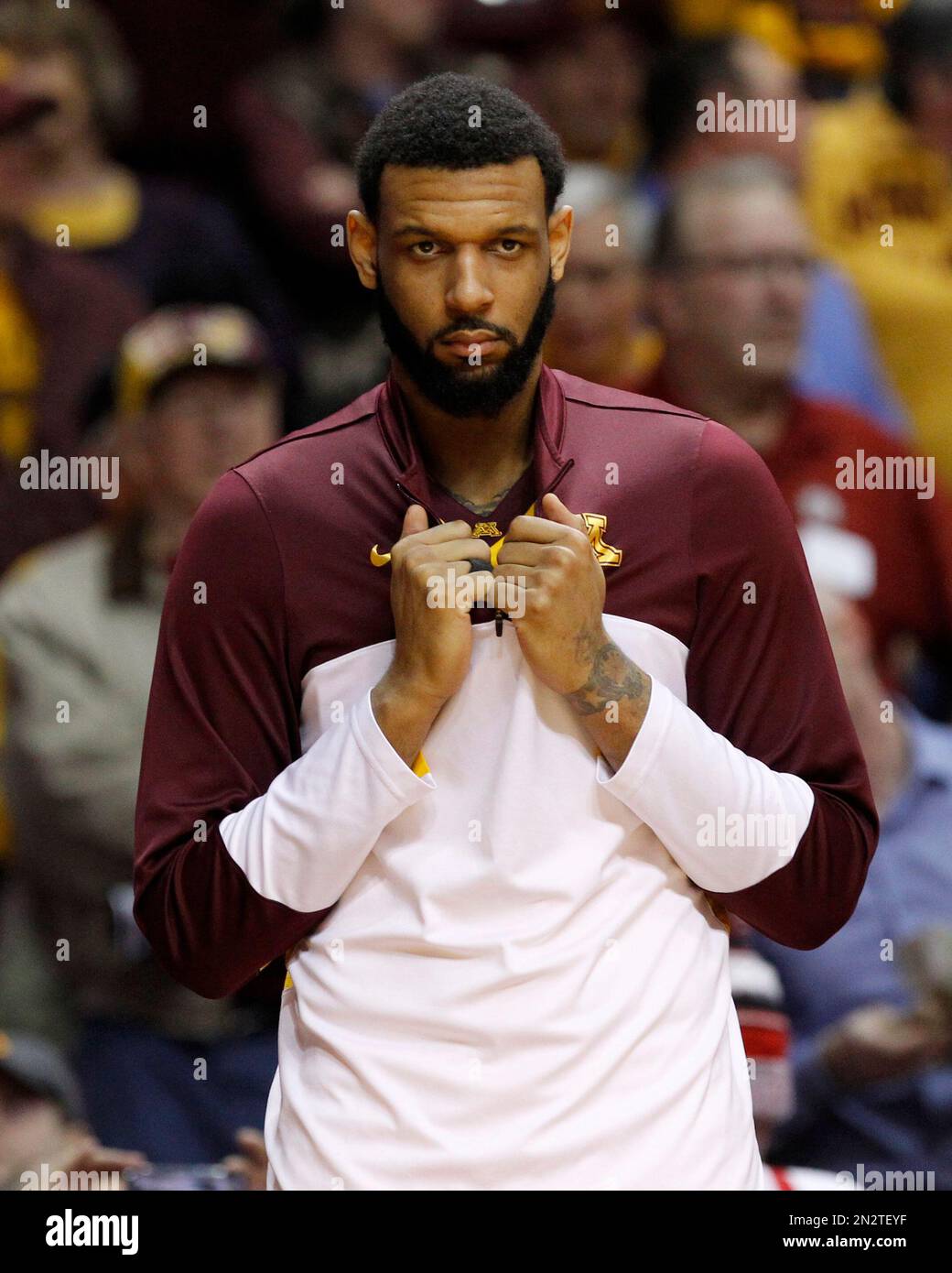 Minnesota forward Maurice Walker waits to be introduced before an NCAA
