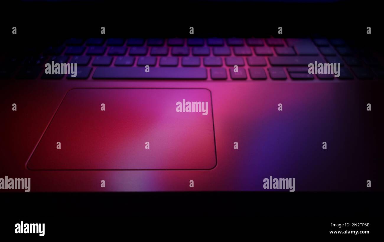 laptop computer keyboard illuminated with lights effects Stock Photo