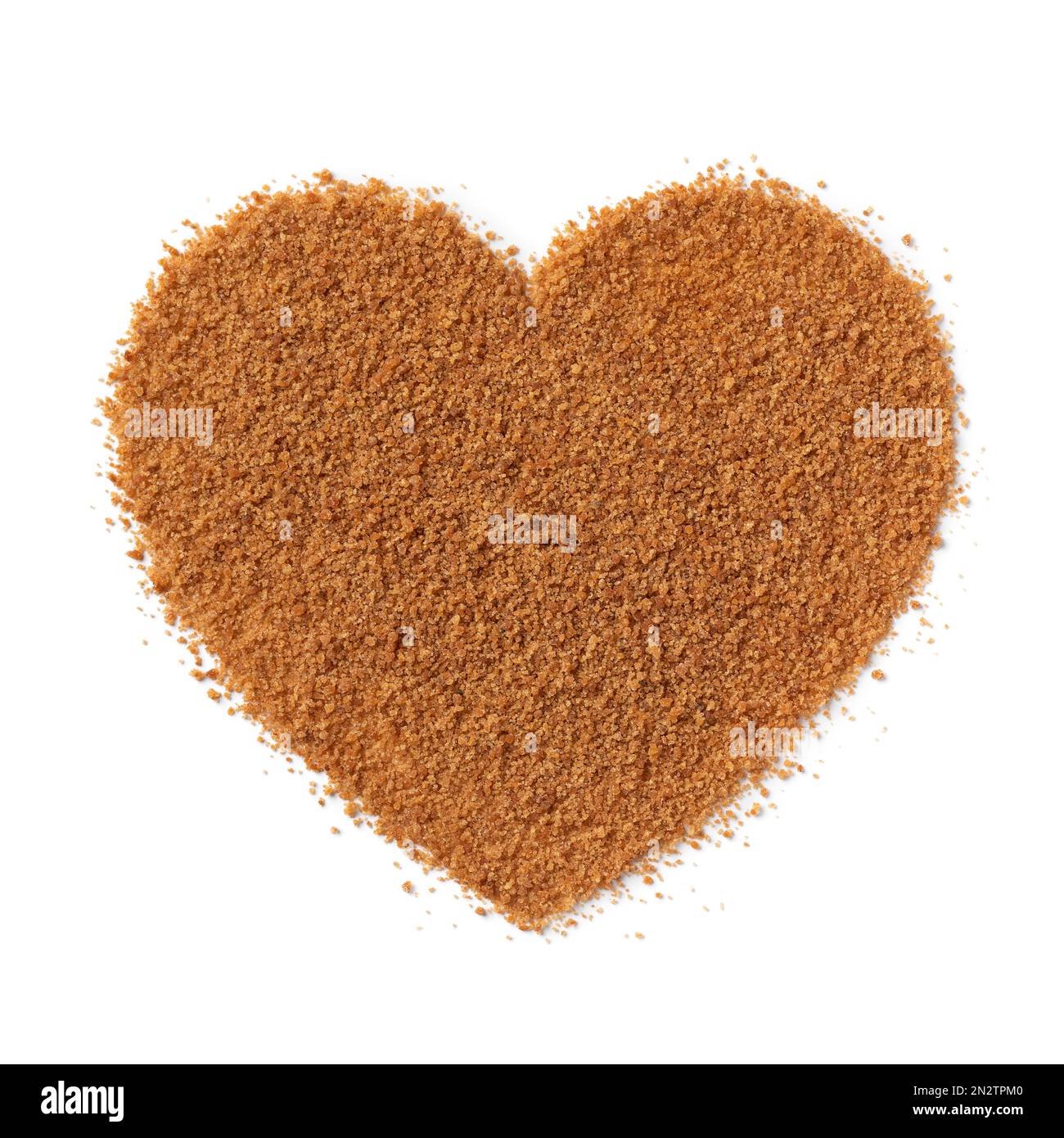 Golden palm sugar in heart shape isolated on white background close up Stock Photo
