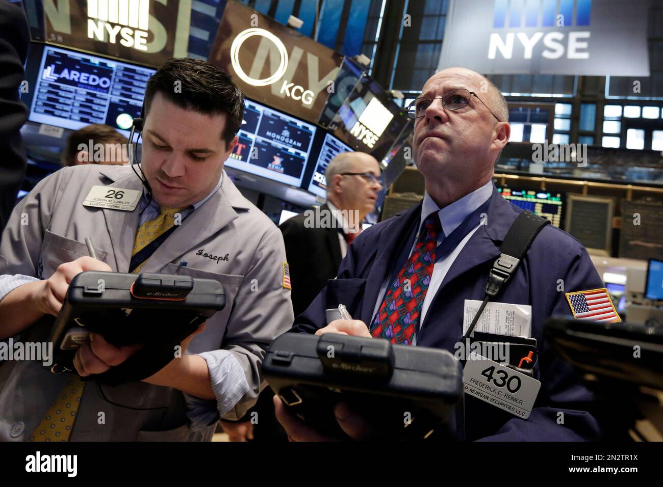 Traders Joseph Lawler, left, and Frederick Reimer, work on the floor of ...