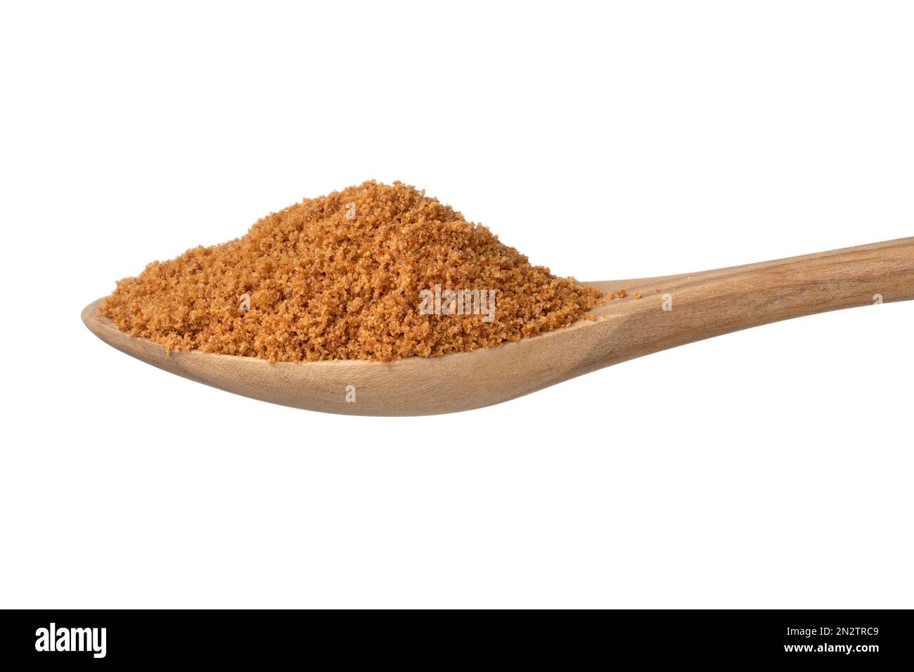 Golden palm sugar on a wooden spoon on white background close up Stock Photo