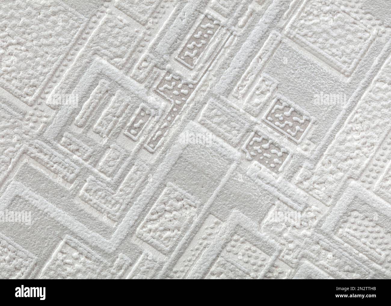The texture of light gray paper wallpaper with a large geometric ...