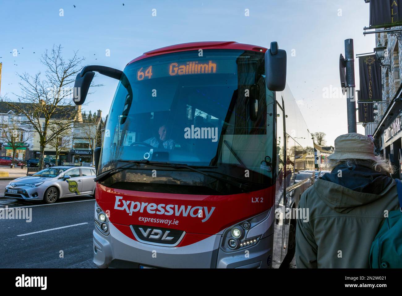 A Bus Eireann Expressway coach to Galway arrives in The Diamond in the centre of Donegal Town, County Donegal, Ireland Stock Photo