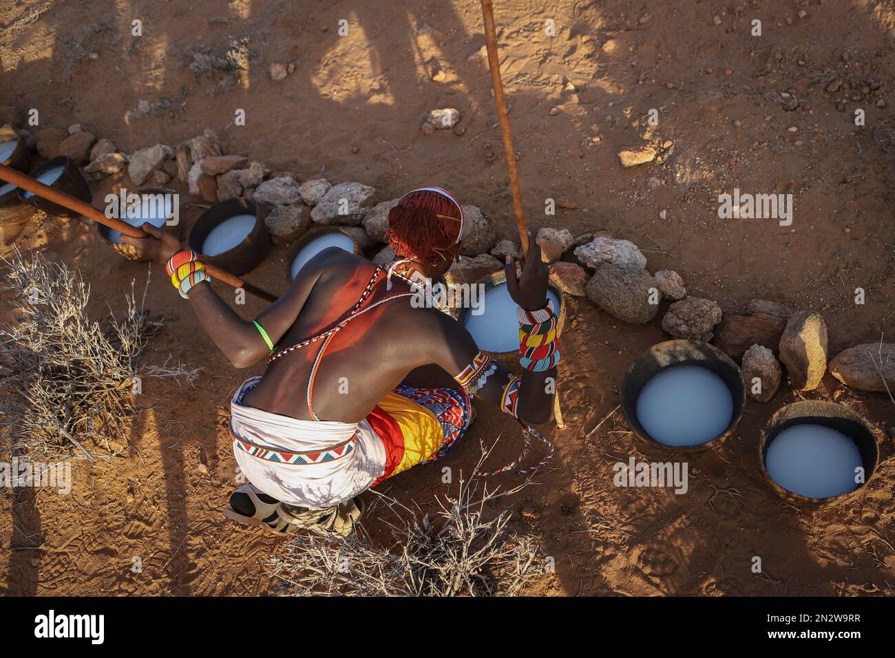 A Moran, or warrior, from the Rendille ethnic group drinks a mixture of ...