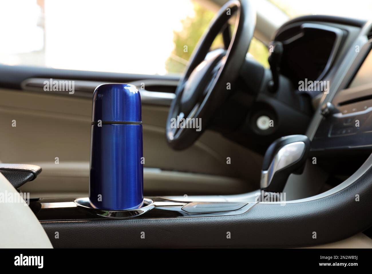 Blue thermos in holder inside of car Stock Photo Alamy