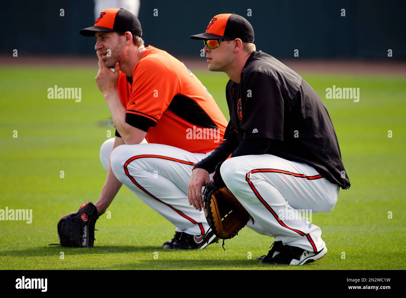 Baltimore Orioles' Mark Hendrickson, right, speaks with catcher