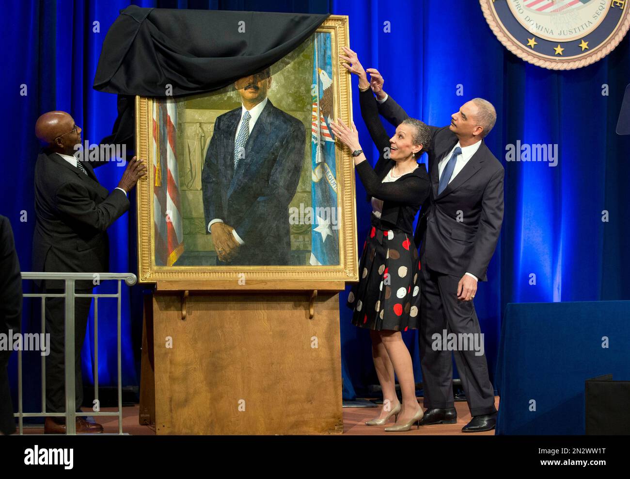 Sharon Malone, center, helps her husband, outgoing Attorney General
