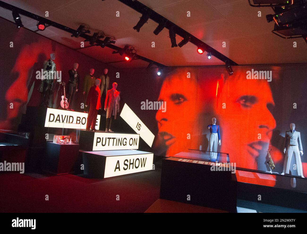 David Bowie Appears On A Giant Screen With Various Costumes He david-bowie-appears-on-a-giant-screen-with-various-costumes-he