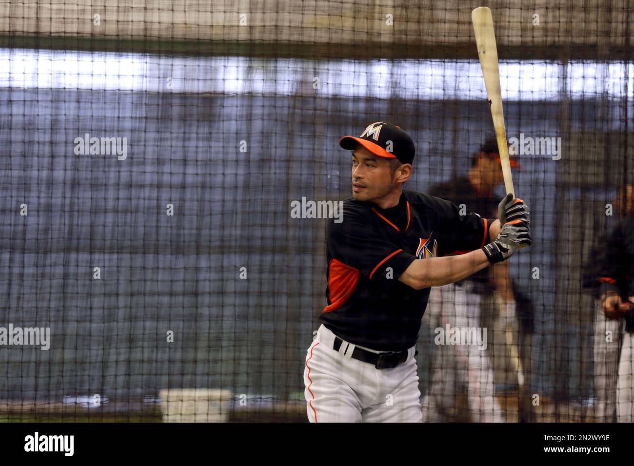 Miami Marlins' Ichiro Suzuki takes his turn in the batting cage during