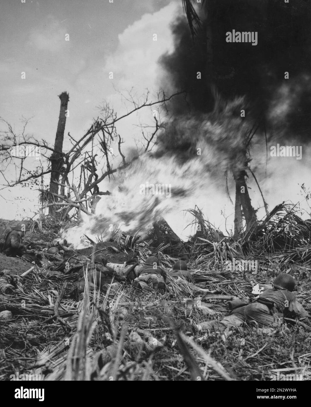 GUAM, MARIANA ISLANDS - August / September 1944 - US Marines use a flamethrower on a Japanese bunker during the Second Battle of Guam in the Mariana I Stock Photo