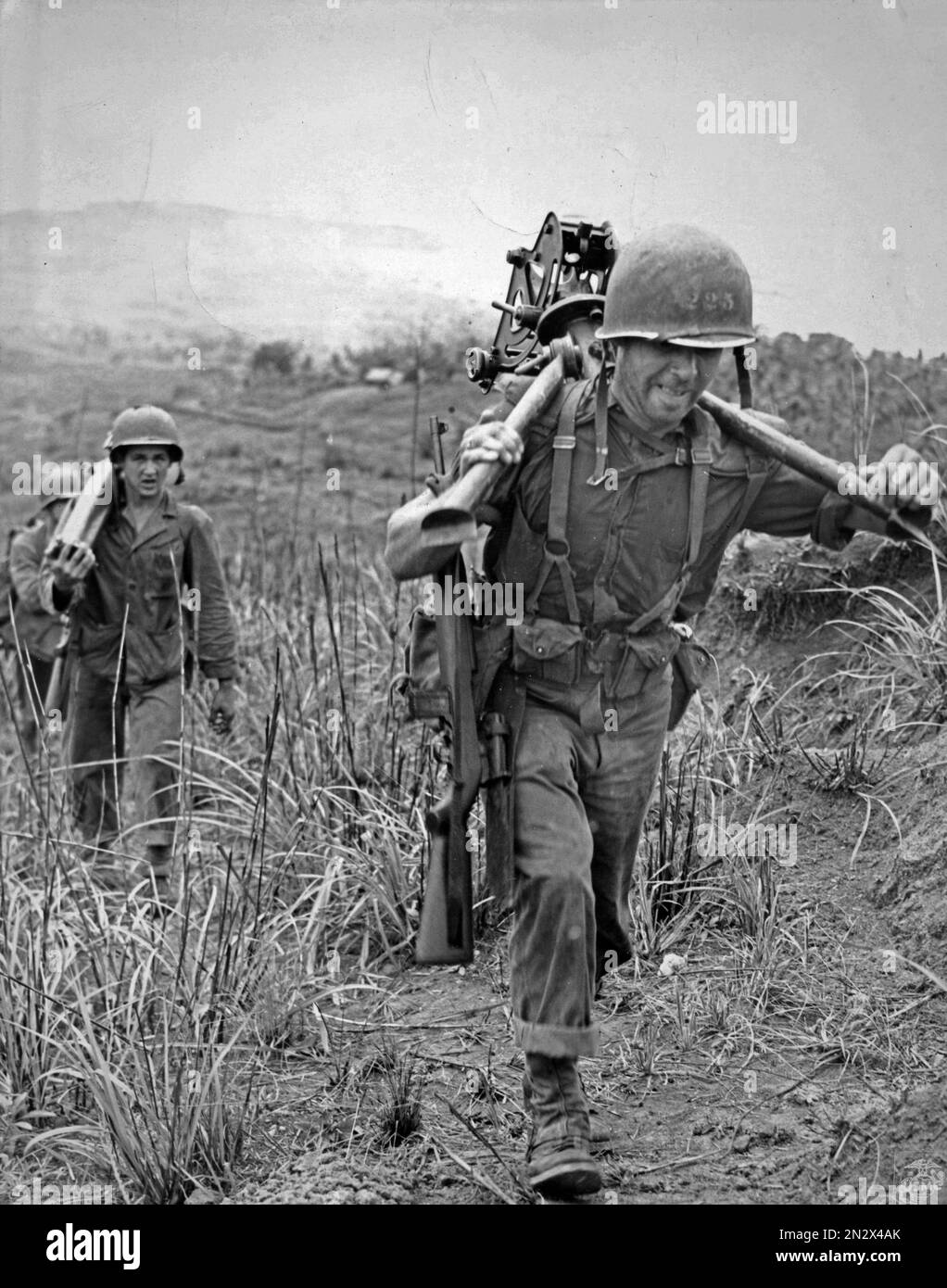 GUAM, MARIANA ISLANDS - August / September 1944 - US Marines move a .30 Browning heavy machine gun during the Second Battle of Guam in the Mariana Isl Stock Photo