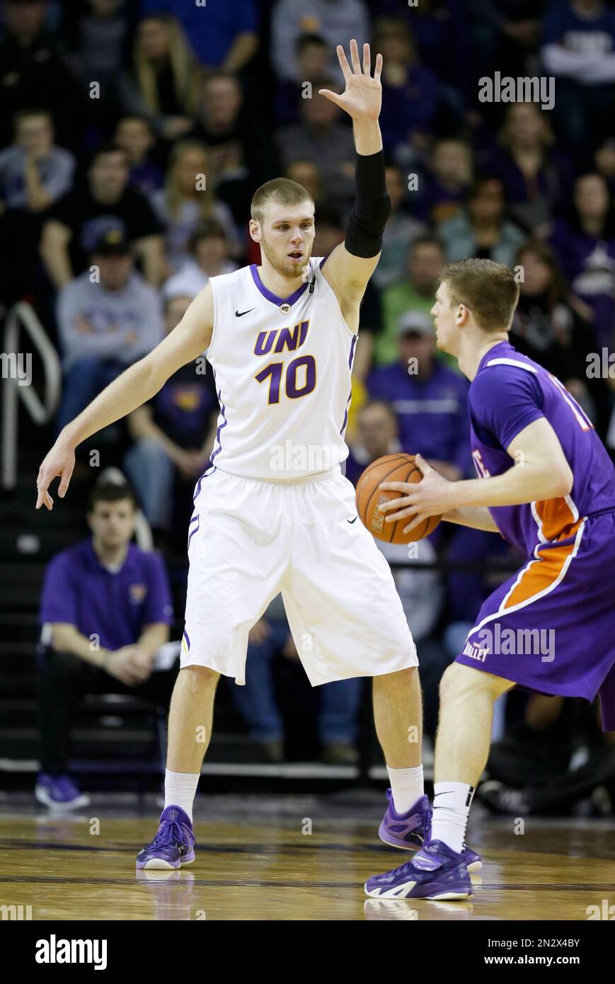 Northern Iowa forward Seth Tuttle (10) guards Evansville guard Adam Wing  during the first half of an NCAA college basketball game, Wednesday, Feb.  25, 2015, in Cedar Falls, Iowa. (AP Photo/Charlie Neibergall
