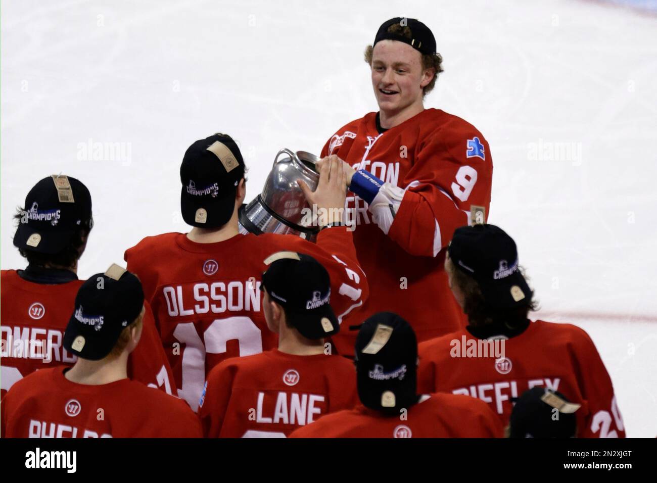 boston-university-forward-jack-eichel-carries-the-beanpot-trophy-over