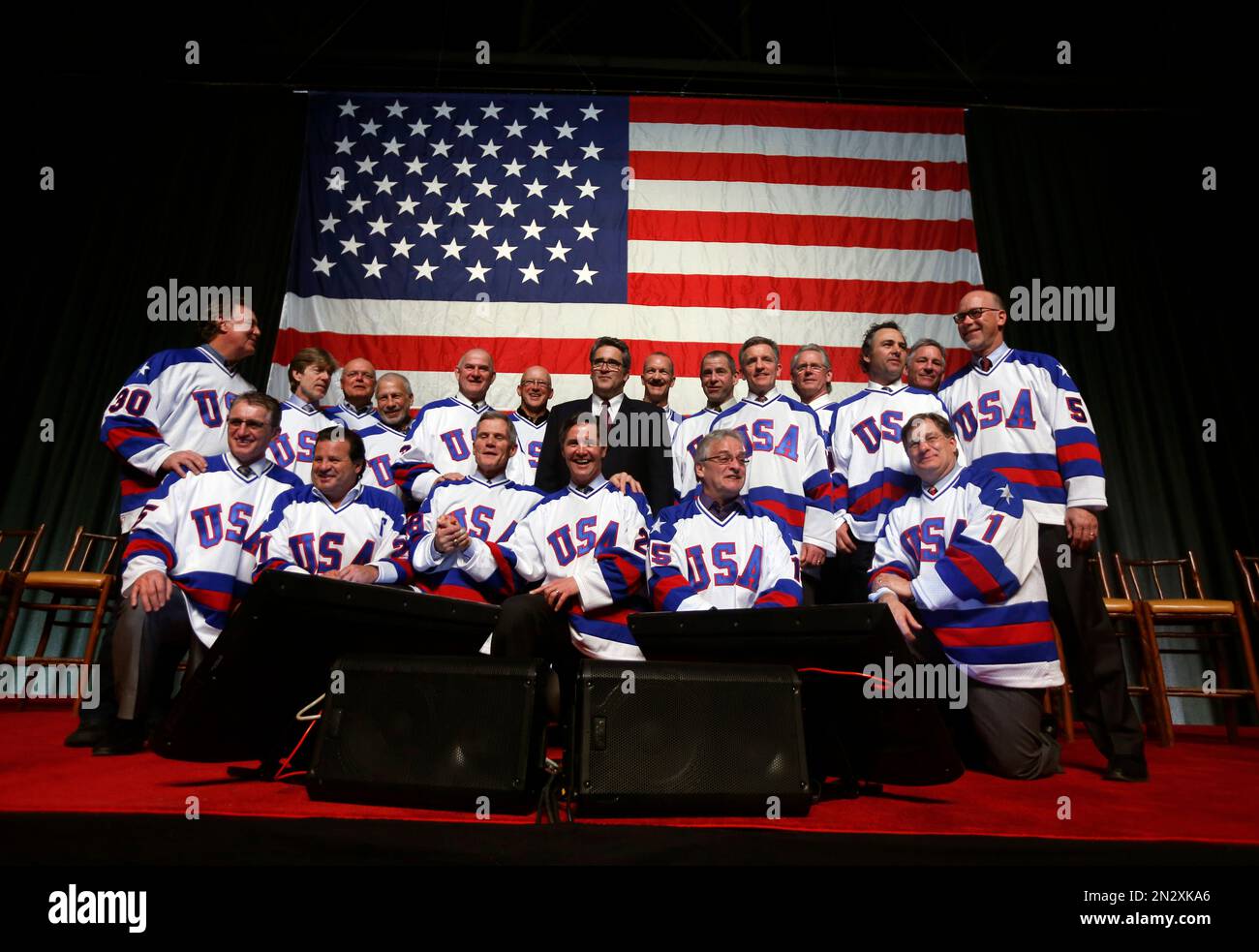 members-of-the-1980-u-s-ice-hockey-team-pose-for-photos-after-a