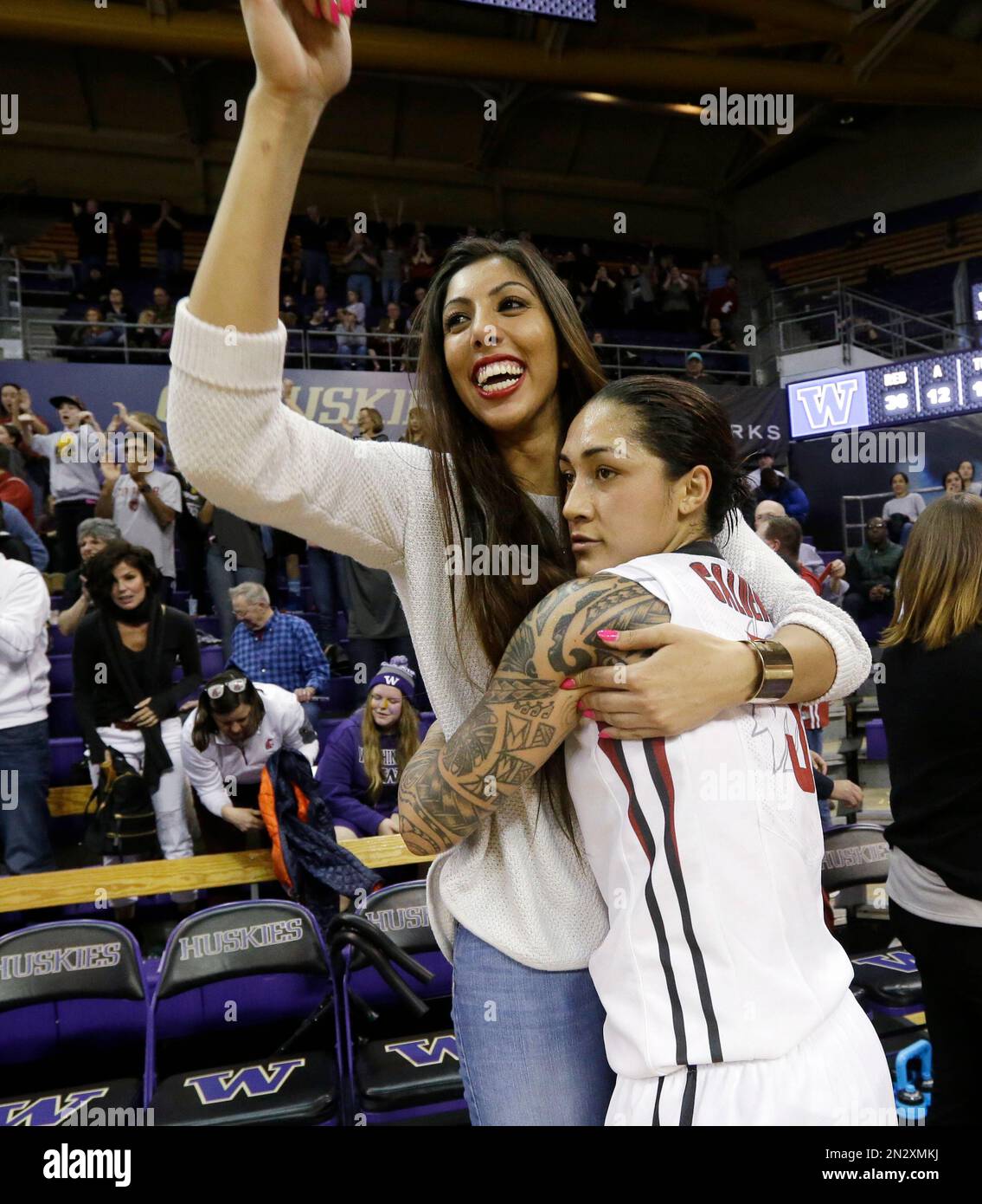 Washington State's Lia Galdeira, right, embraces teammate Shalie ...