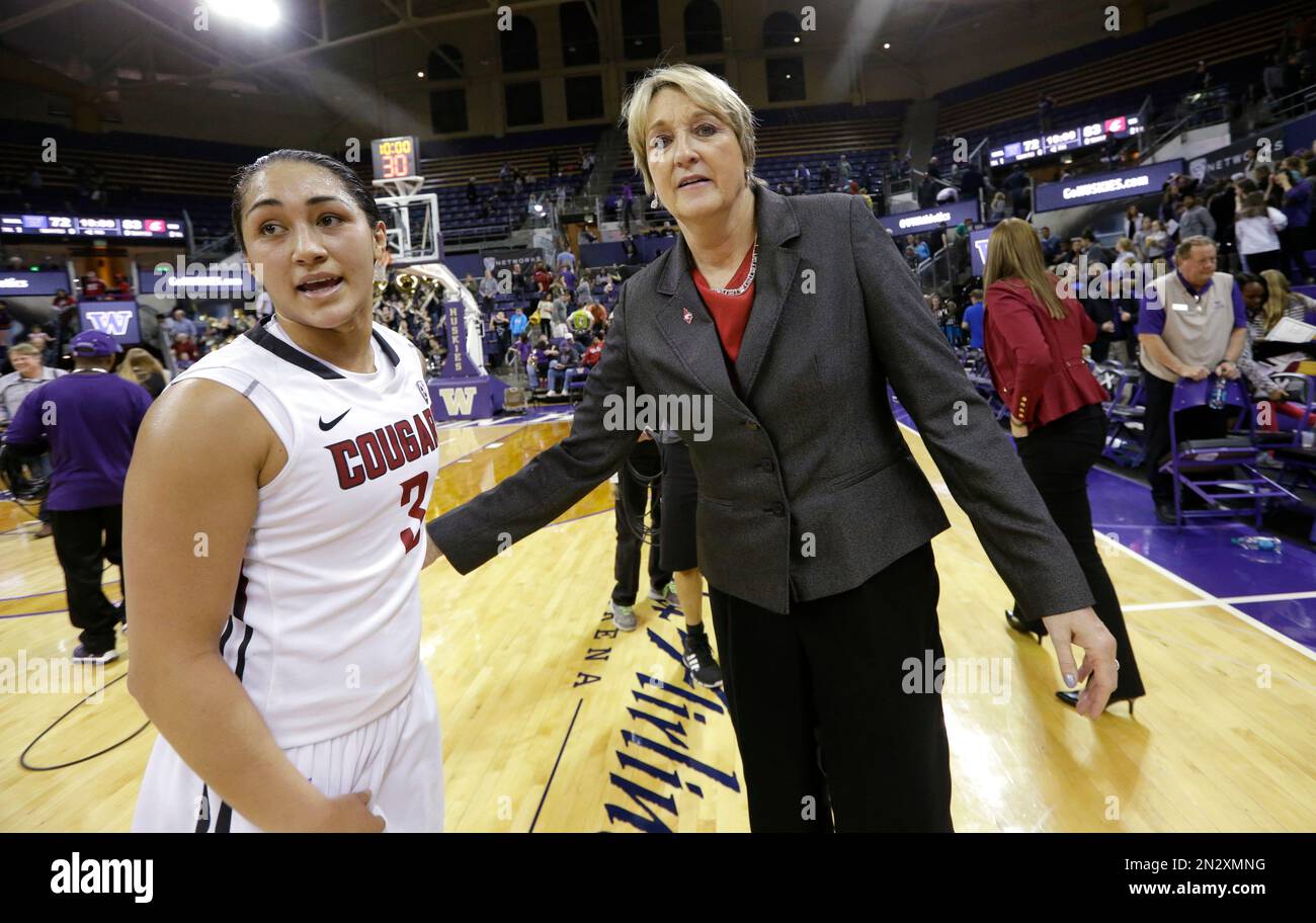 Washington State head coach June Daugherty, right, heads off the court