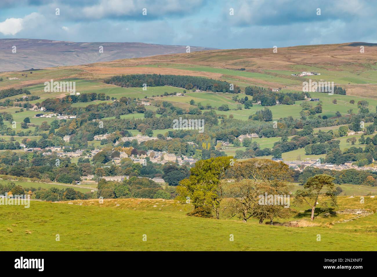 Down into Middleton in Teesdale from Bail Hill, Mickleton in slightly hazy autumn sunshine. Stock Photo