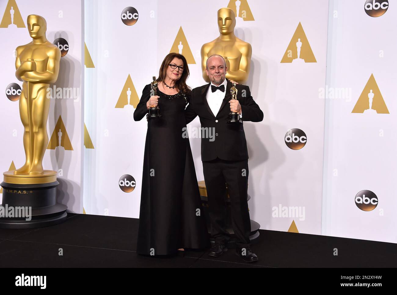Frances Hannon, left, and Mark Coulier pose in the press room with the