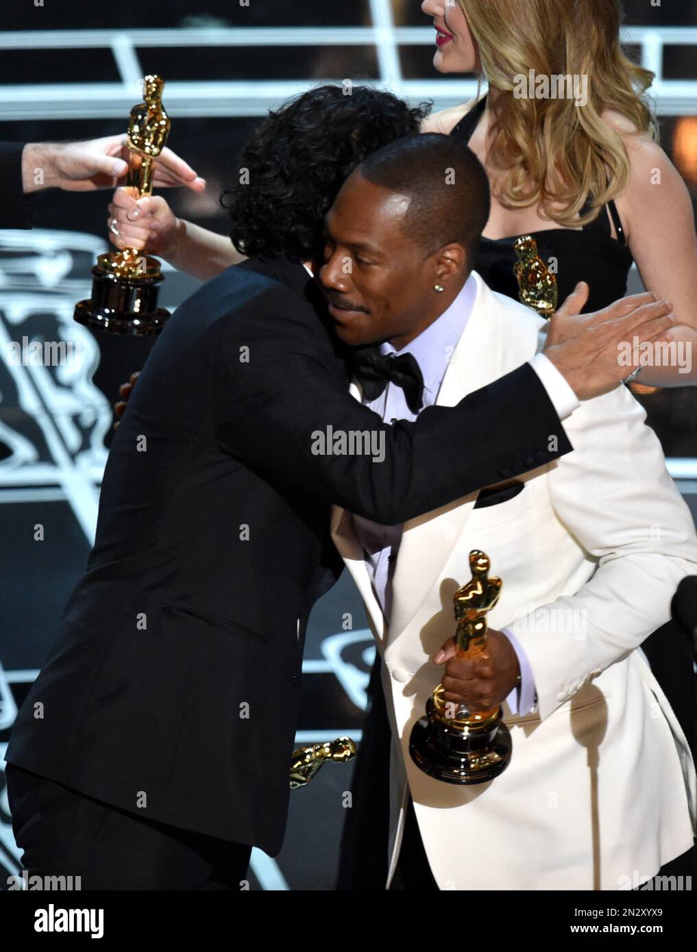 Eddie Murphy, right, presents Alejandro G. Inarritu with the award for