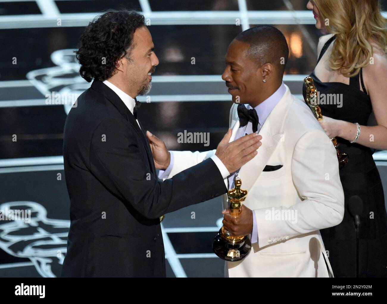 Eddie Murphy, right, presents Alejandro G. Inarritu with the award for(00)