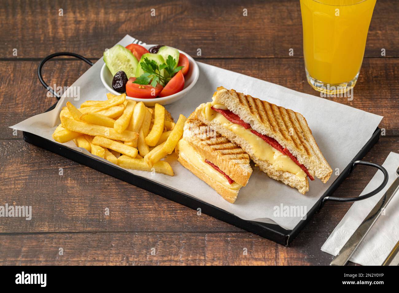 Toast with cheddar cheese and turkish sausage with french fries and